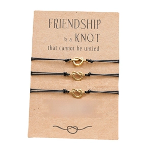 Three-piece friendship wish bracelets with gold knots on display card for women