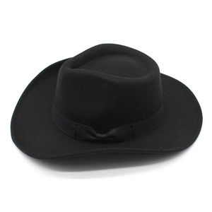 Classic black wool felt western cowboy hat featuring a sleek ribbon bow and curved brim