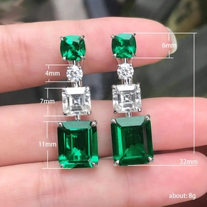 Elegant emerald cut zircon dangle earrings in silver finish with size and weight details