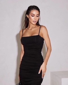 Detailed close-up of the black ruched bodycon dress with elegant spaghetti straps