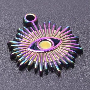 Macro shot of 18k plated rainbow evil eye pendant with radiant metal texture details