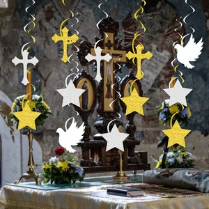 Religious party hanging decorations with gold stars and silver crosses in a church setting