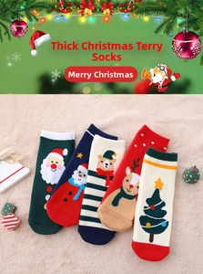 Detail showing five pairs of thick Christmas terry socks with festive cartoon patterns