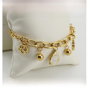 Close-up of gold stainless steel bracelet with crystal flower and mirror ball charms