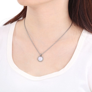 Detailed view of silver necklace featuring a round white opal pendant and twist rope chain