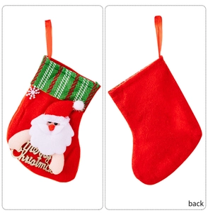 Front and back detail of a red Christmas stocking with a 3D Santa Claus applique and logo