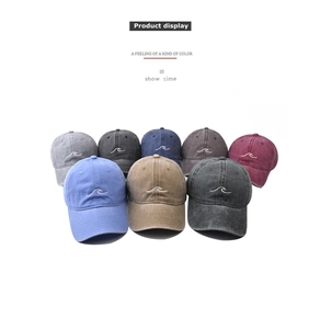 Matrix display of vintage washed cotton baseball caps with wave embroidery in multiple colors