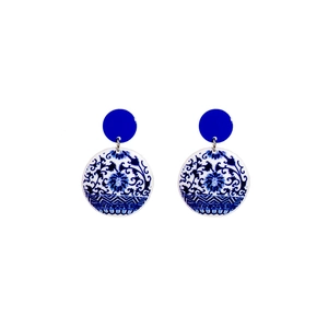 Blue and white porcelain style drop earrings with traditional floral patterns on white background