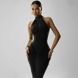 Detail of elegant black halter neck dress featuring ruched waist and side slit details