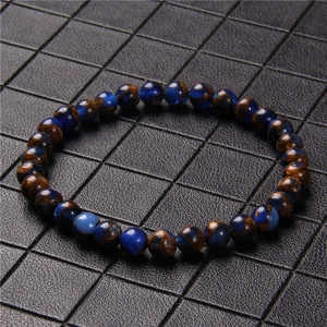 Detail of 6mm blue tiger eye stone beads on an elastic bracelet with polished texture