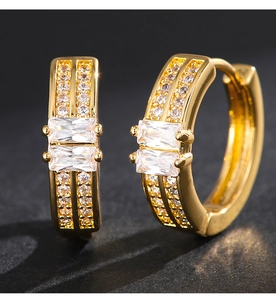 Detail showing gold hoop earrings with double row pave and square cut zircons
