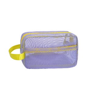 Large purple mesh beach bag with yellow handles for kids' sand toys storage