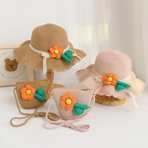 Detailed close-up of girls straw hats and matching bags with floral and lace accents