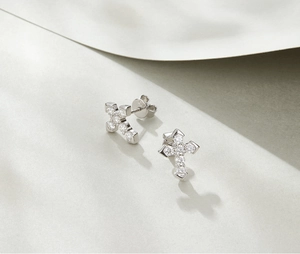 Macro shot of S925 sterling silver cross studs with micro-pave cubic zirconia