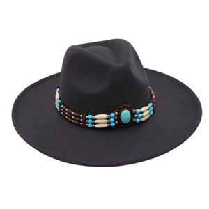 Detailed view of dark grey wide brim fedora hat with ethnic turquoise beads and wool felt texture