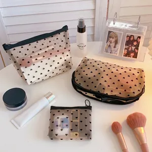 Three-piece set of black mesh cosmetic bags with heart print for makeup storage