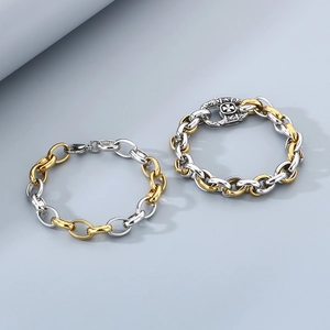 Bracciale bicolore oro e argento in acciaio al titanio per uomo dallo stile industriale