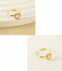 Close-up of heart zircon ring with 18K gold plating and adjustable stainless steel band