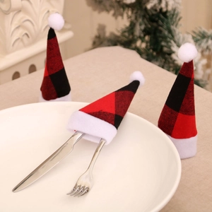 Festive red and black plaid Christmas cutlery holders with white pompom decorations