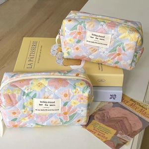 Quilted floral cosmetic bags set in light blue fabric with soft oil painting flower patterns