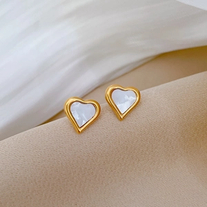 Minimalist heart-shaped stud earrings featuring white shell inlay and gold-plated steel