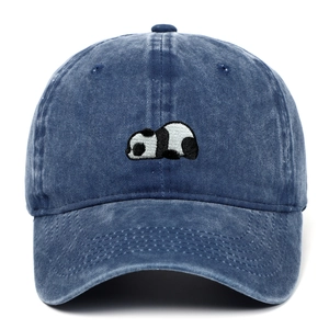 Macro detail of high-quality panda embroidery on navy blue washed cotton baseball cap