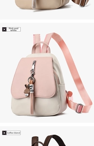 Close-up of pink and beige PU leather mini backpack with long tassels and rabbit charm