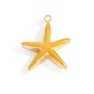Macro shot of gold starfish charm with polished mirror finish and top circular ring