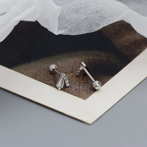 Macro view of S925 sterling silver V-shape piercing stud with micro-set zircon accents