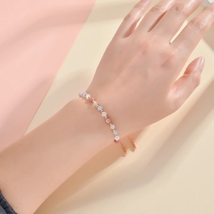 Faceted 4mm natural stone crystal beaded bracelet with adjustable cord on model wrist