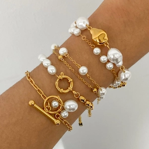 Minimalist gold-tone stainless steel pearl bracelet set for women featuring baroque pearls