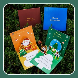 Detailed 3D pop-up Christmas cards featuring Santa, reindeer, and tree on green background