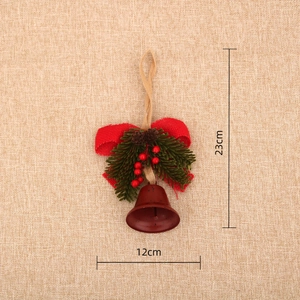 Detail view of 23cm Christmas door hanger with red metal bells and pine cones
