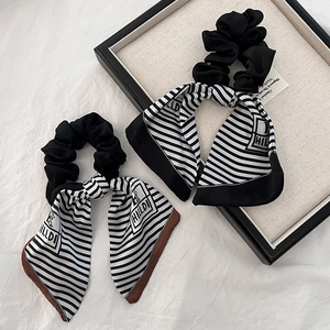 Elegant silk hair scrunchies with striped scarf ribbons in black and white colors