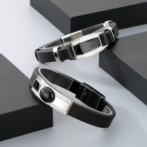 Detail of 316L stainless steel clasp and leather band with pavé zircon stones on mens bracelet