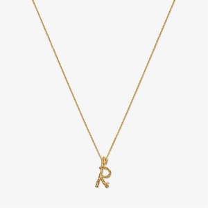 Detail of gold letter R pendant with textured surface and sparkling white crystals