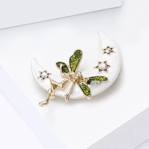 Golden moon goddess brooch with white enamel, rainbow stones and green glitter wings