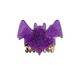 Glitter purple bat-shaped hair claw clip for Halloween with a metallic spring mechanism