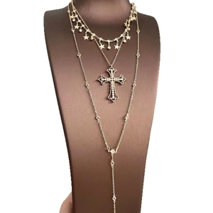 Three-layer gold cross and stars pendant necklace set with rhinestone tassel detail