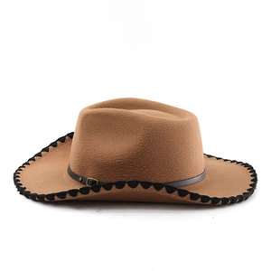 Detailed view of brown wool western hat with black woven trim and thin leather band