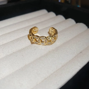 Detail of 18k gold plated open ring with hollow coin pattern and zircon stones