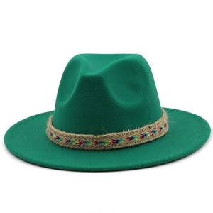 Detail of dark green wool fedora featuring a rainbow braided band on a wide flat brim