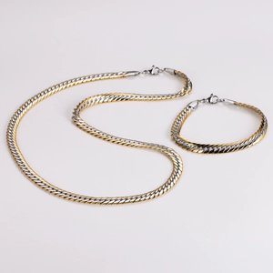 Detail of 7.5mm dual-tone gold and silver woven chain necklace and bracelet set