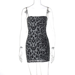 Detail of grey and black leopard print sequins on a tight-fitting camisole dress