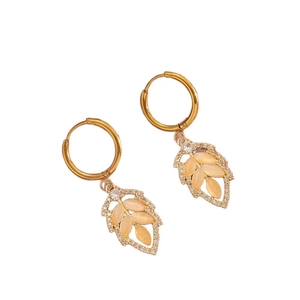 Elegant gold leaf earrings with orange cat eye stones and sparkling zircons set