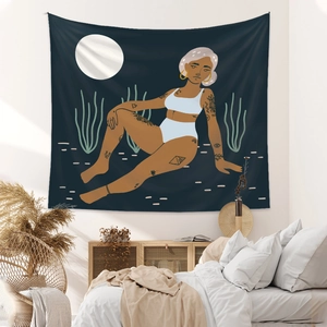 Detail of bohemian desert night wall tapestry featuring an artistic moonlit illustration
