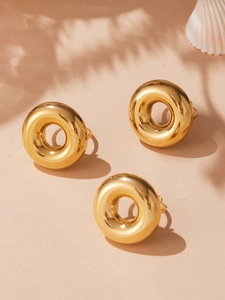 Detailed view of high-polished 18k gold plated stainless steel thick hoop earrings