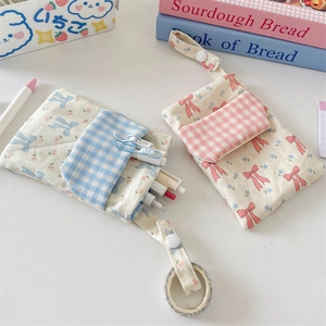 Close-up of floral pocket protector with double layers and secure button strap