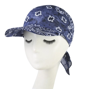 Detail of navy blue paisley bandana cap with sun visor and adjustable tie back