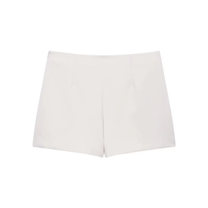 Detail view of white minimalist skorts with asymmetrical design and side zipper closure